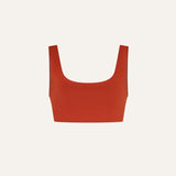 Product flat lay front view, terracotta red swim top