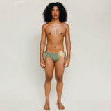 Front view of model wearing green knotted bikini bottom