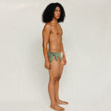 Side view of model in Sylvia bikini bottom, mineral green 