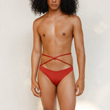 Terracotta red striped bikini bottom with anatomical coverage designed for a secure, gender-affirming and non-binary tuck-friendly fit.