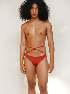 Terracotta red striped bikini bottom with anatomical coverage designed for a secure, gender-affirming and non-binary tuck-friendly fit.