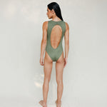 Person wearing Marsha one-piece swimsuit in mineral green, back view