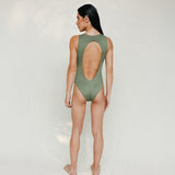 Person wearing Marsha one-piece swimsuit in mineral green, back view