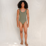 Person wearing Marsha one-piece swimsuit in mineral green, back view