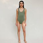 Person wearing Marsha one-piece swimsuit in mineral green, front view