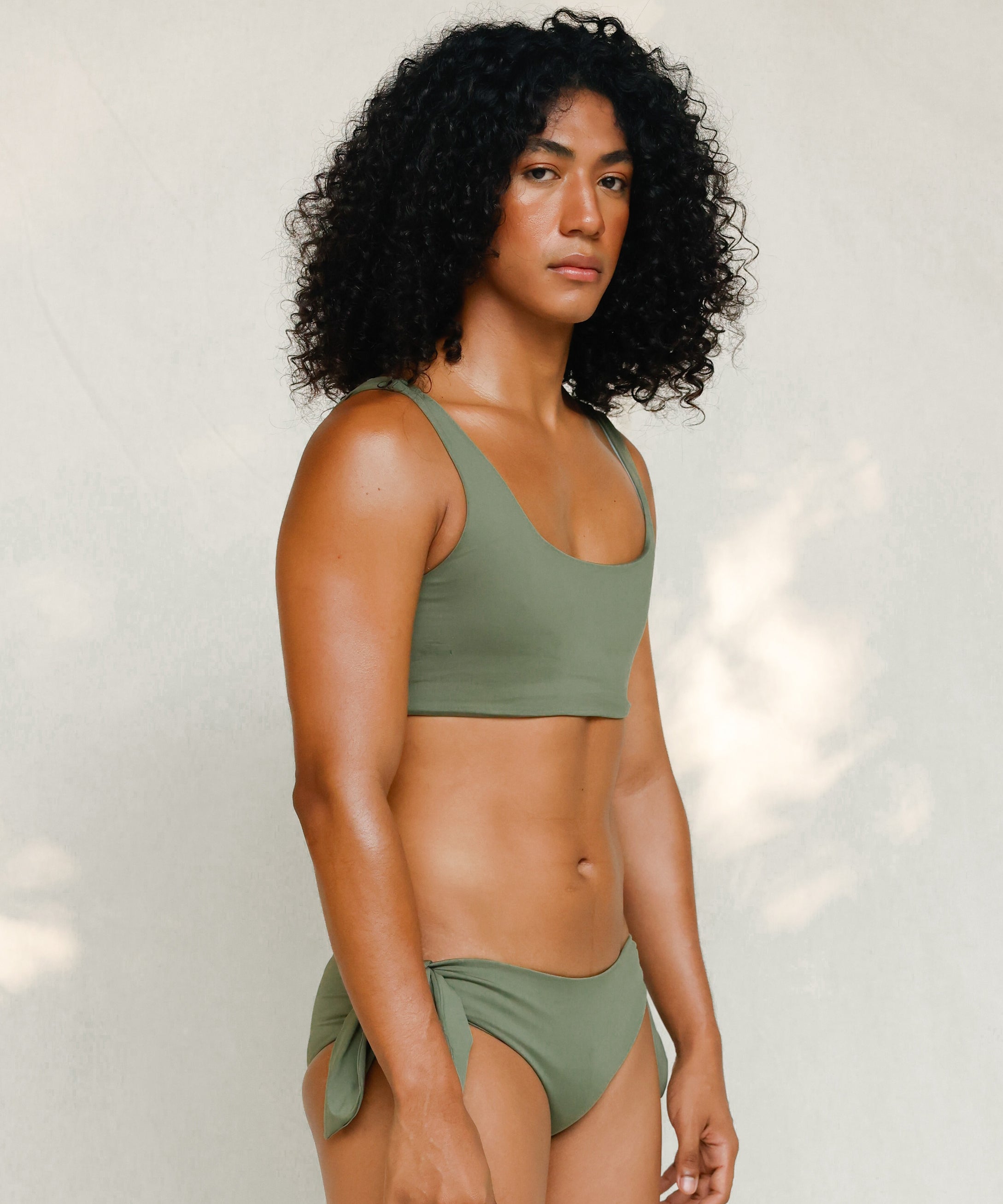 Side view of model in Audre top, mineral green