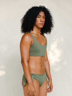Side view of model in Audre top, mineral green