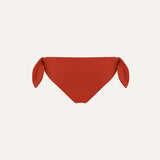 Product flat lay back view, terracotta red bikini bottom
