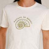 Close up front view of model wearing white tee with Nature is Queer print 